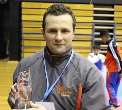 Matt with appreciation award from Taekwondo NSW